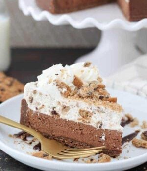 A close up of a chocolate mousse cake with a layer of chocolate chip cookie mousse on top