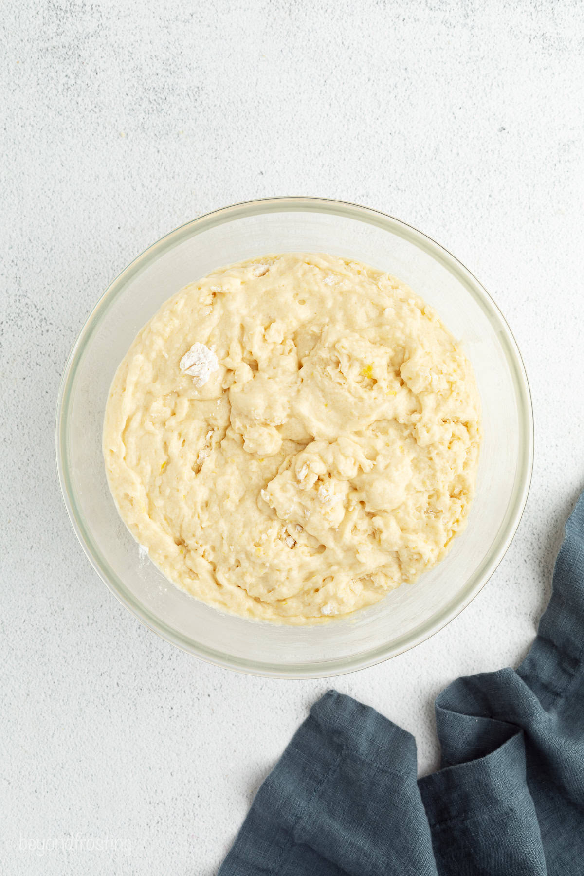 Lemon muffin batter in a bowl.