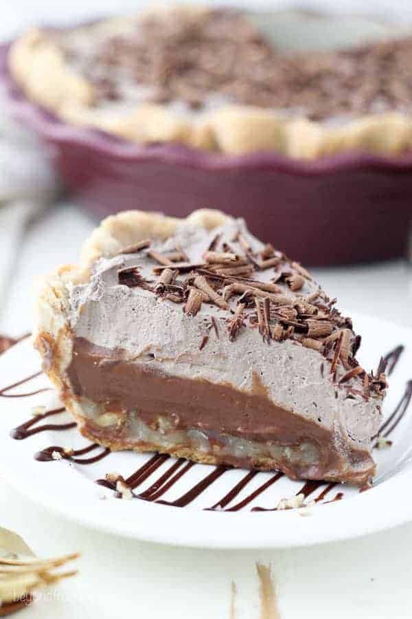 The beautiful slice of German Chocolate pie shows 3 different layers and it's topped with chocolate shavings.
