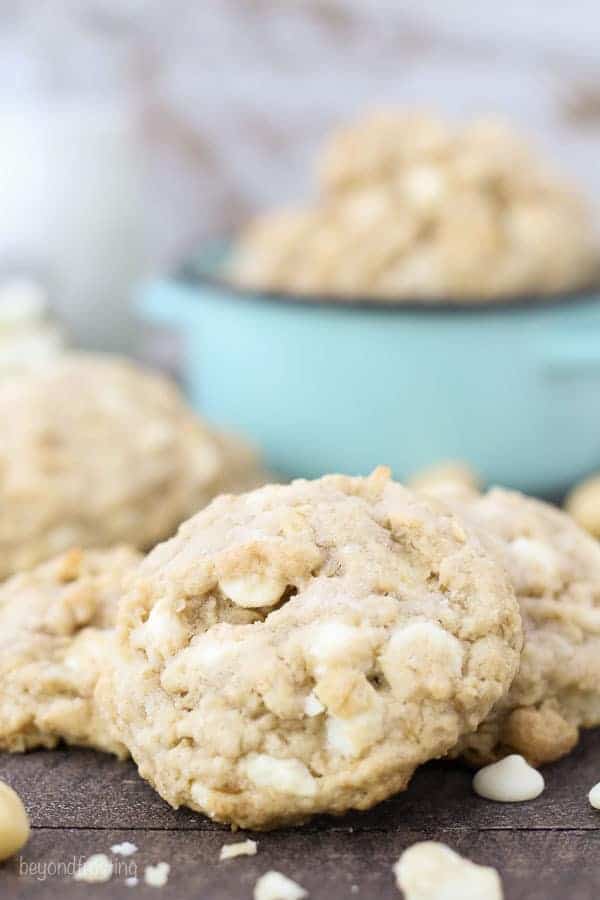 A close up shot of an Oatmeal Macadamia Nut Cookie on a wooden surface