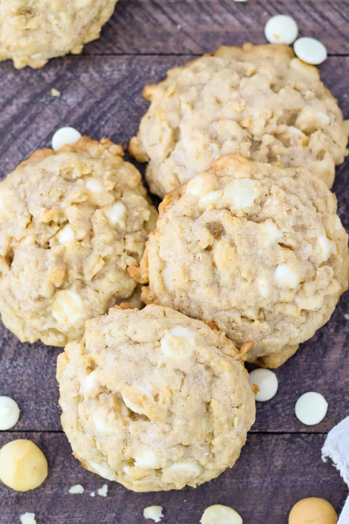 These chunky, no-chill oatmeal macadamia nut cookies are soft, chewy, and loaded with salty macadamia nuts and creamy white chocolate chips. Overhead view of oatmeal white chocolate macadamia nut cookies.