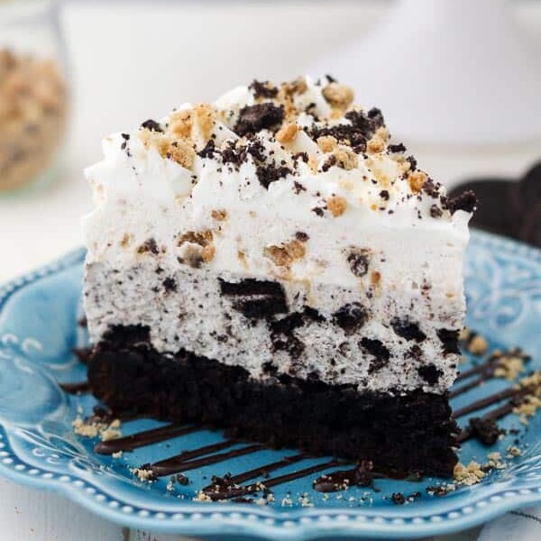 A close up shot of an large slice Oreo Brookie Mousse Cake