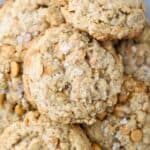 An overhead view of a gorgeous plate of butterscotch oatmeal cookies sprinkled with salted caramel