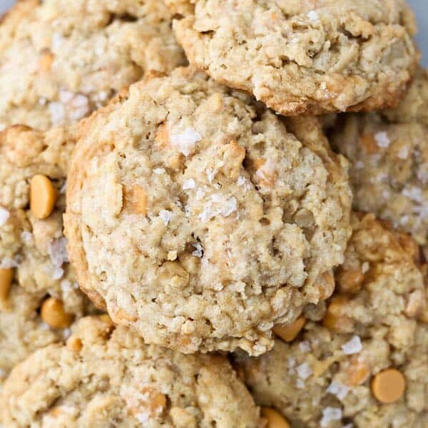 An overhead view of a gorgeous plate of butterscotch oatmeal cookies sprinkled with salted caramel