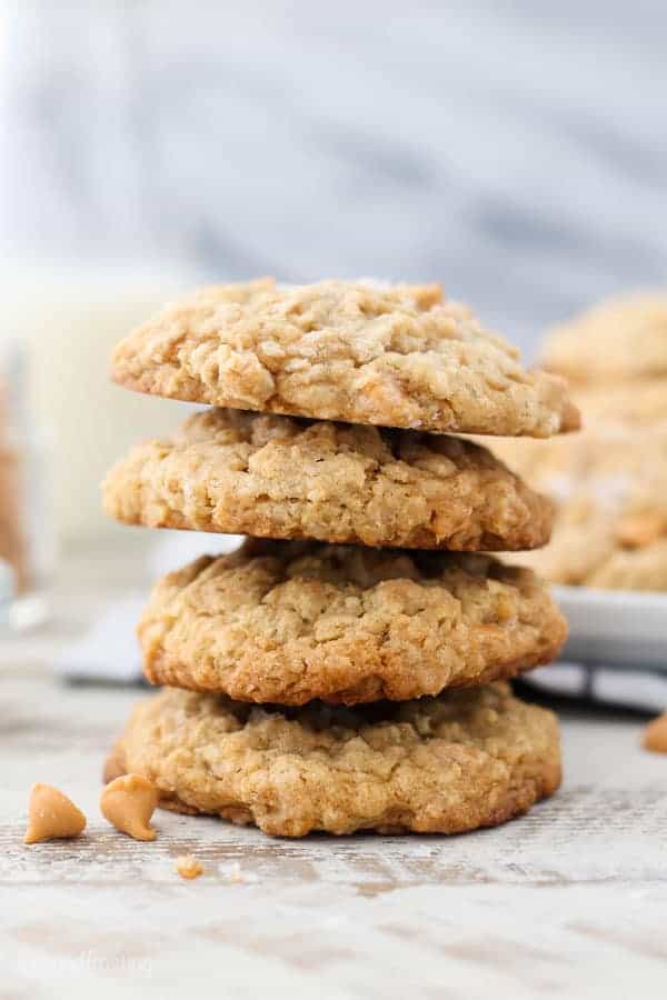 A tall stack of 4 oatmeal cookies garnished with butterscotch chips