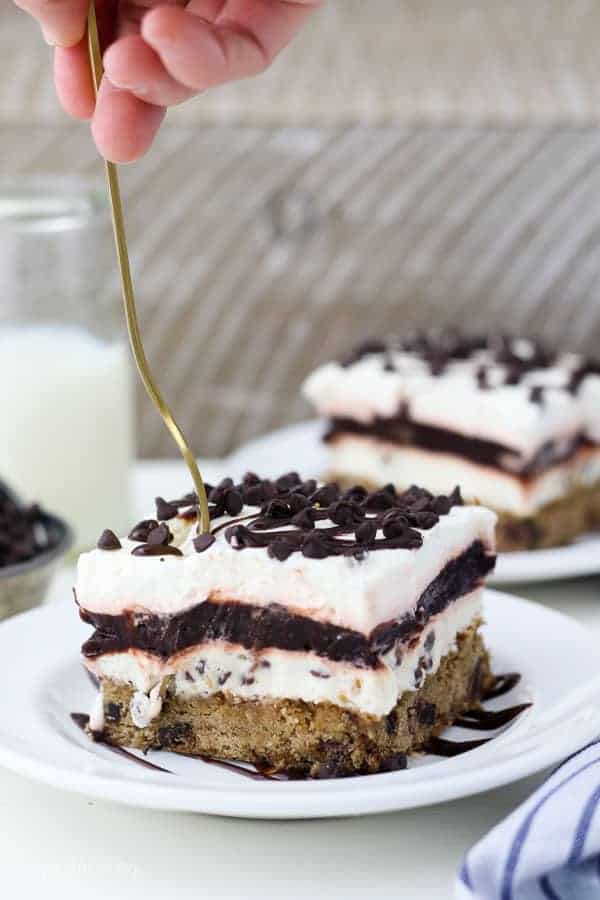 A gold fork sinking into this chocolate chip cookie icebox cake