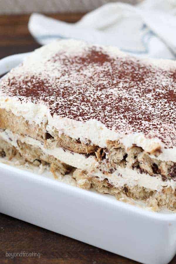 A pan of tiramisu made with Chocottone bread layered with whipped mascarpone cheese and dusted with cocoa powder
