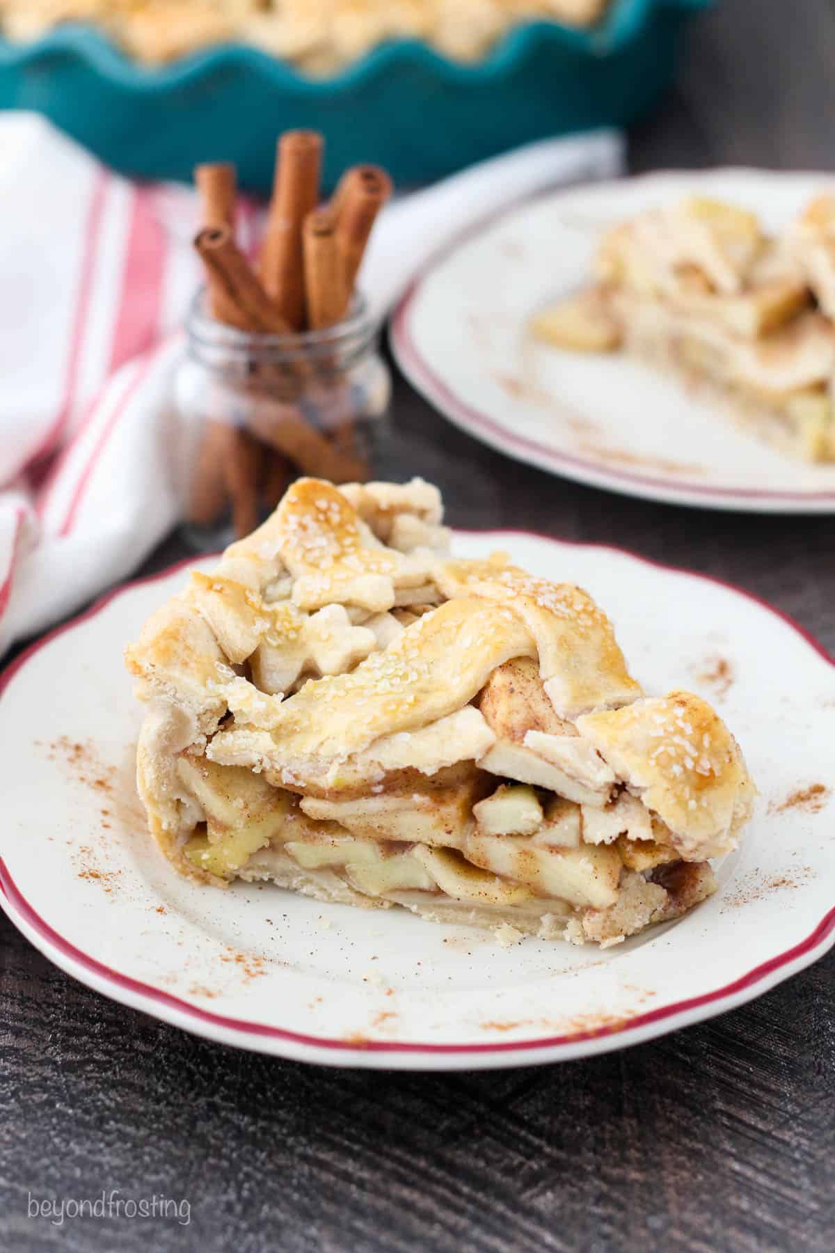 A perfect slice of layers of apple pie with a lattice crust