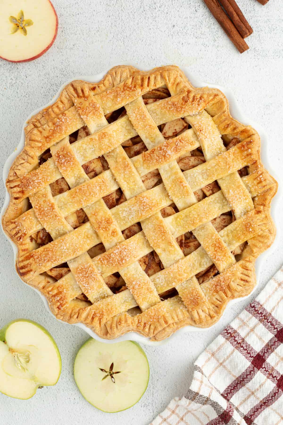 Overhead view of baked homemade apple pie with a woven lattice top crust.
