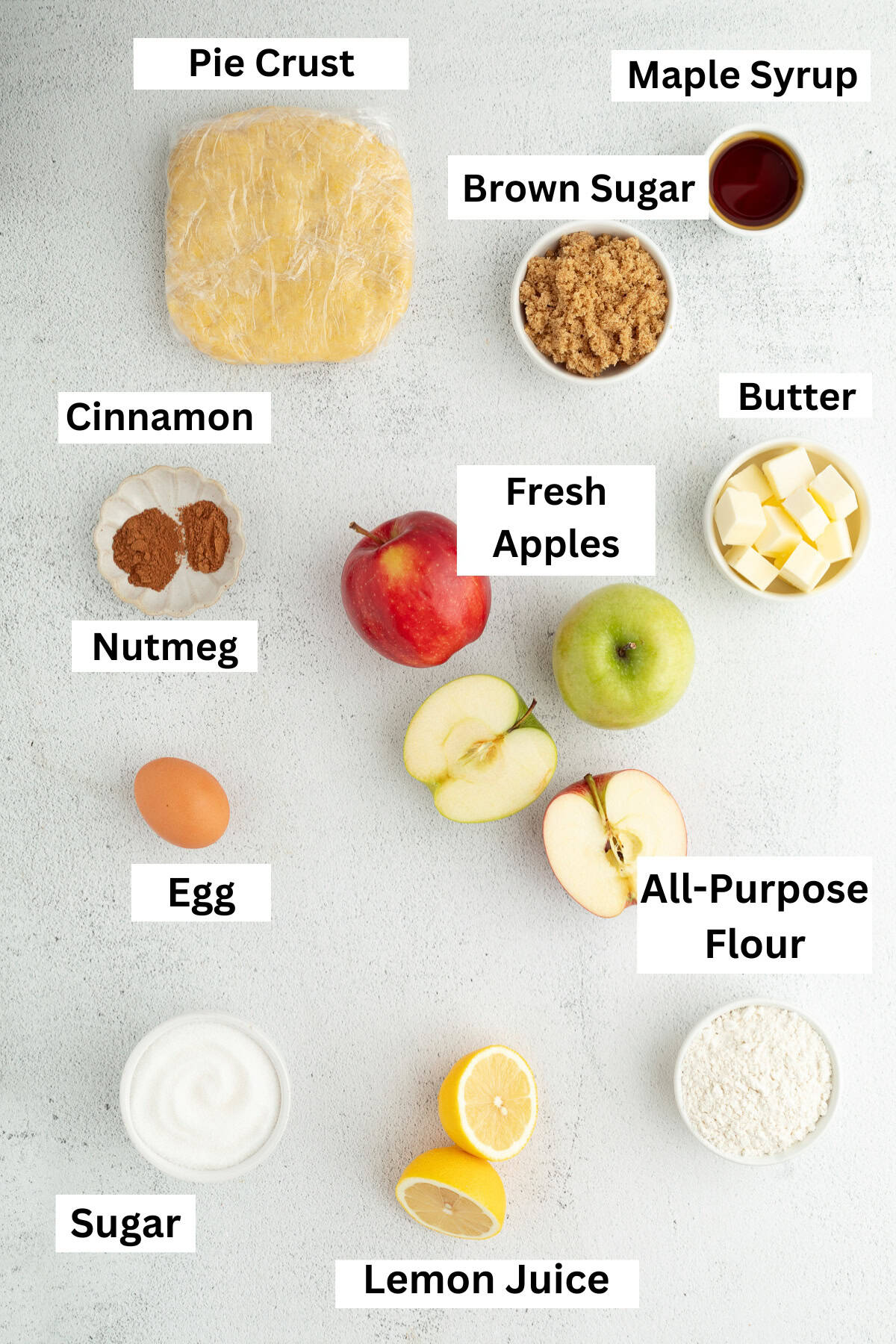 Apple pie ingredients with text labels overlaying each ingredient.