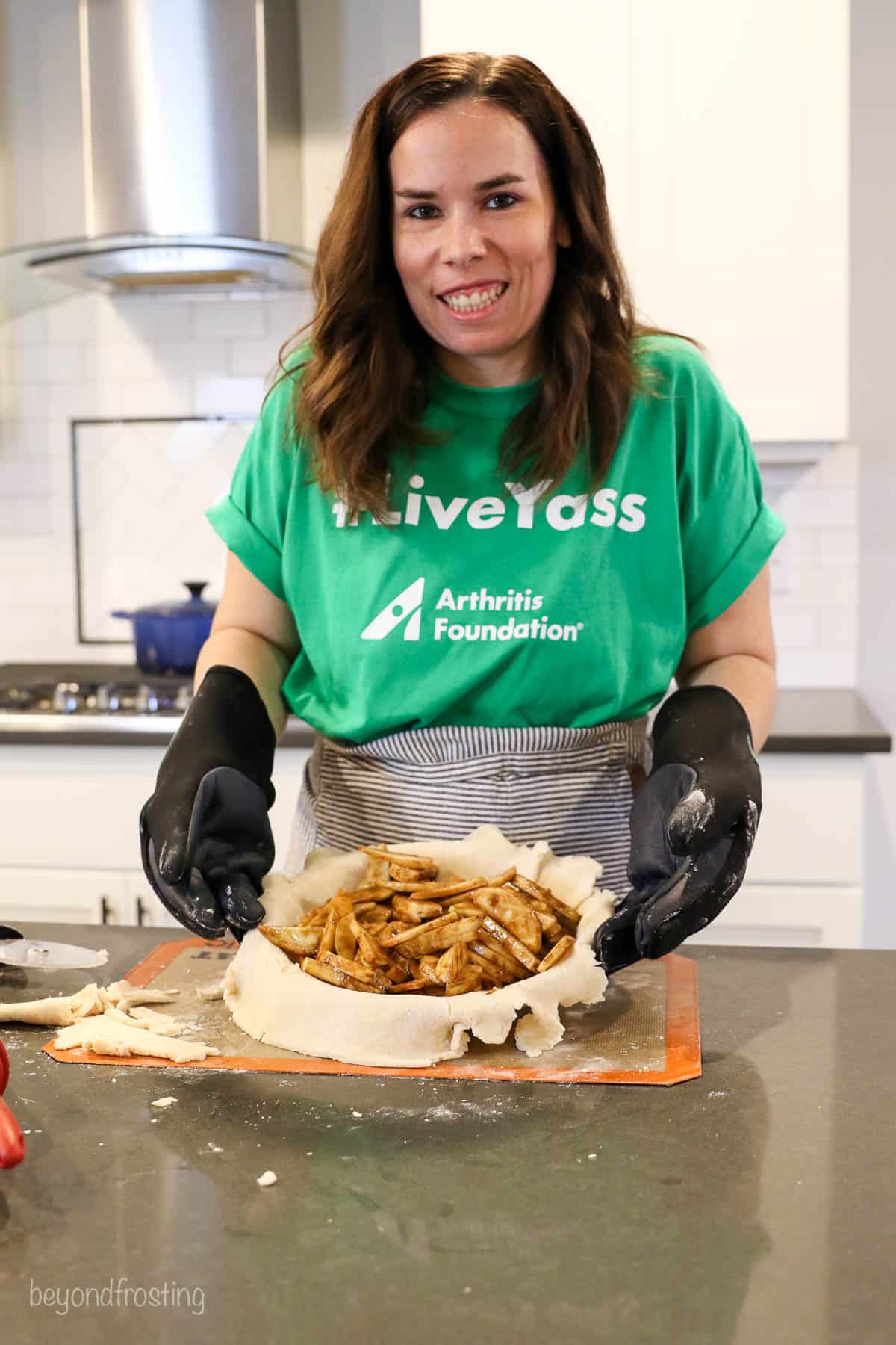 The Arthritis Foundation Let's Get a Grip campaign, food blogger Julianne from Beyond Frosting using the arthritis gloves to make an apple pie
