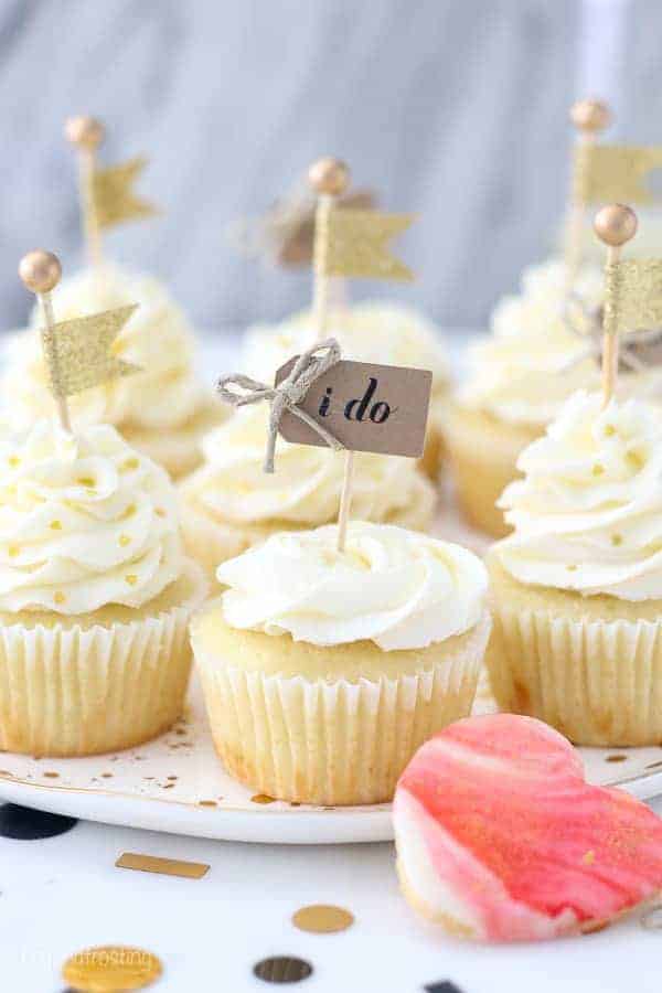 These engagement themed cupcakes are super cute decorated with a buttercream rose and a little cupcake topper that says "I do"