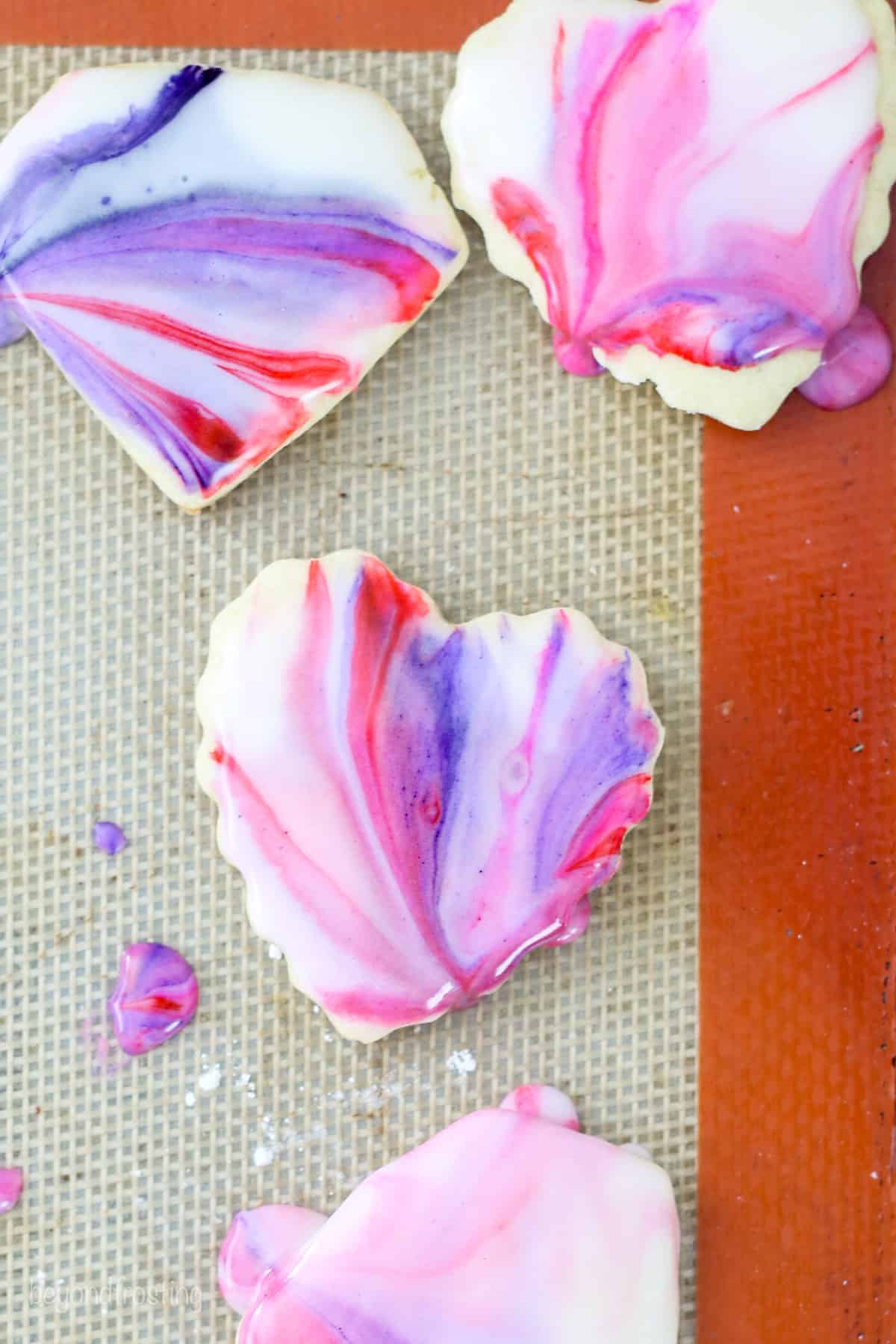 Heart-shaped sugar cookies decorated with marbled icing.