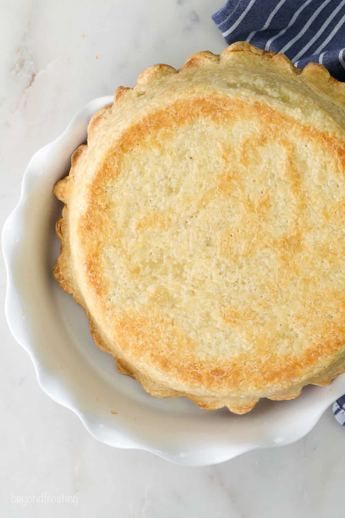 Prebaked pie crust in a pie dish.