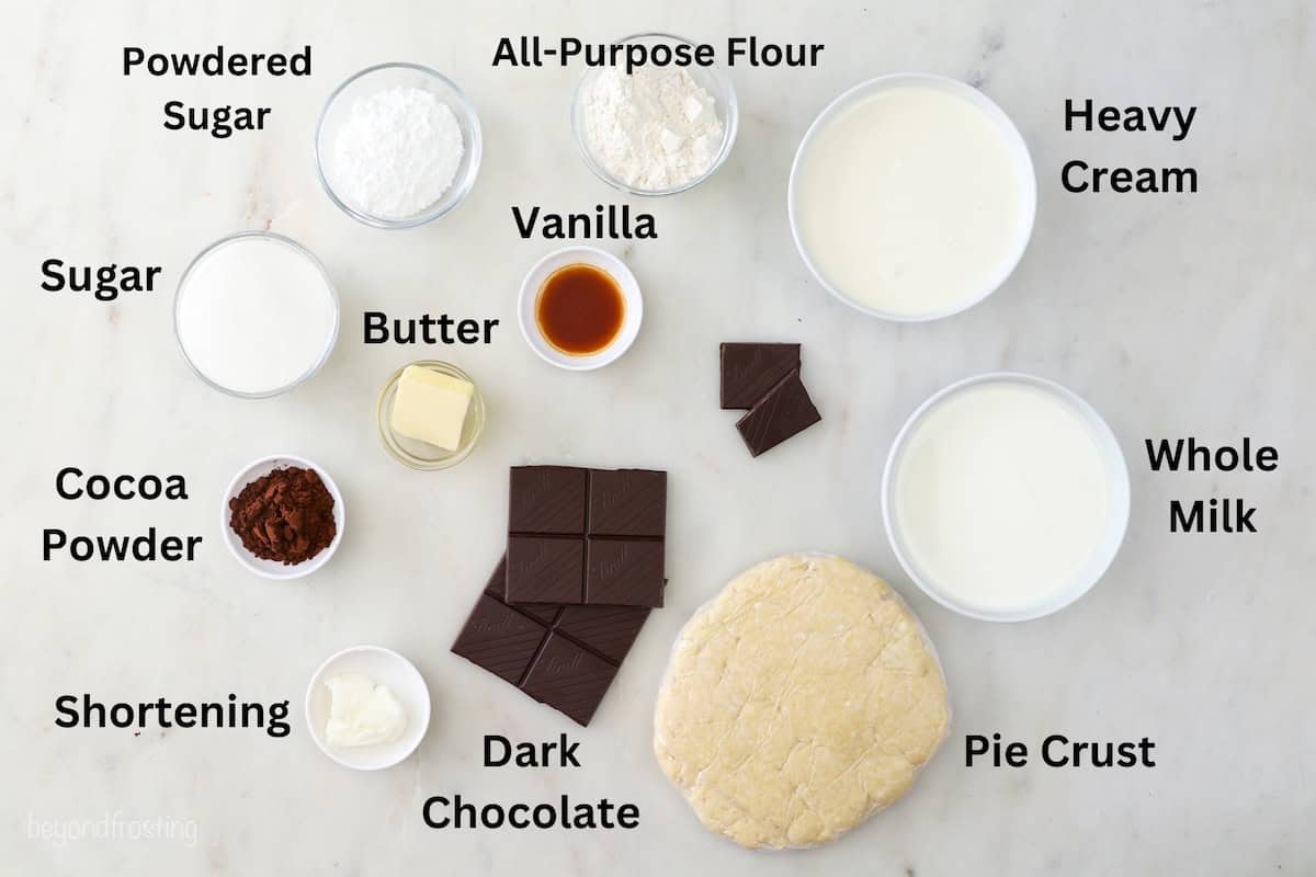 Ingredients for chocolate pie on a marble counter.