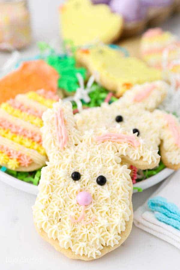 Easter bunny sugar cookie decorated with white buttercream .