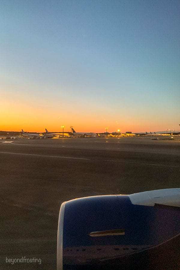 Nartia Airport, view out the plane window with the sun setting in the background