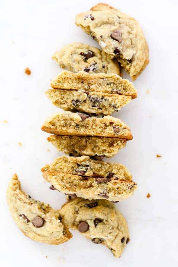 A big stack of cookie halves, showing the insides of the cookies