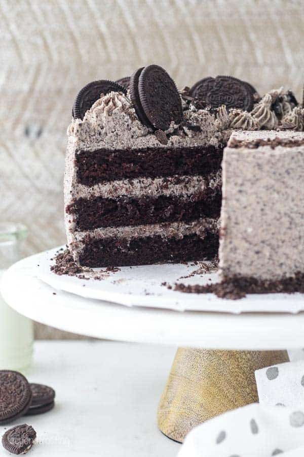 A 3 layer chocolate cake with Oreo frosting and topped with whole Oreos and more frosting