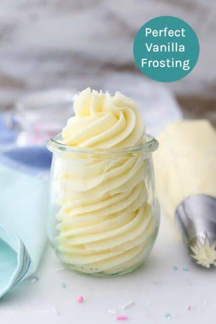 Perfect Vanilla Frosting | A small jar of piped vanilla buttercream with a full piping bag sitting next to it