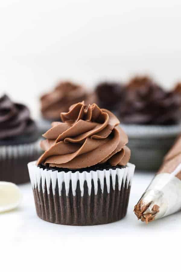 A gorgeous chocolate cupcake topped with a fluffy chocolate frosting