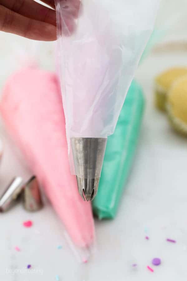 A picture showing a piping tip fitted in a piping bag