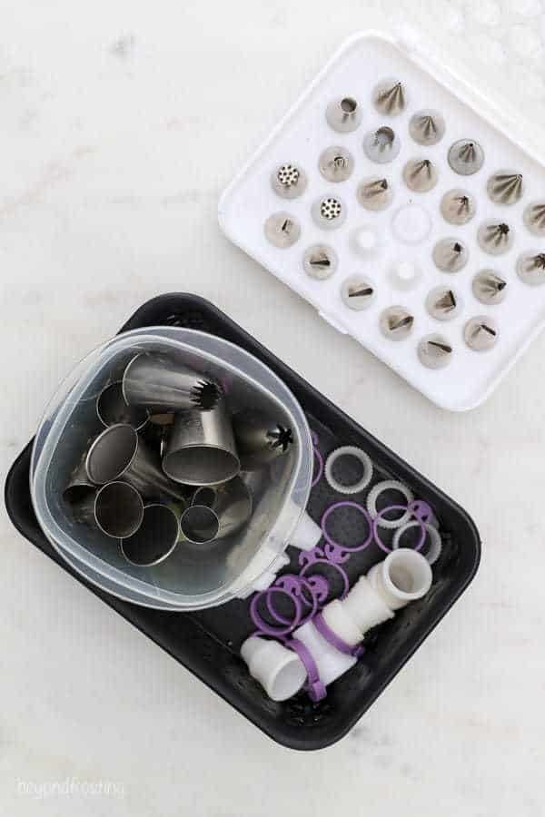 A box filled with piping tips and couplers