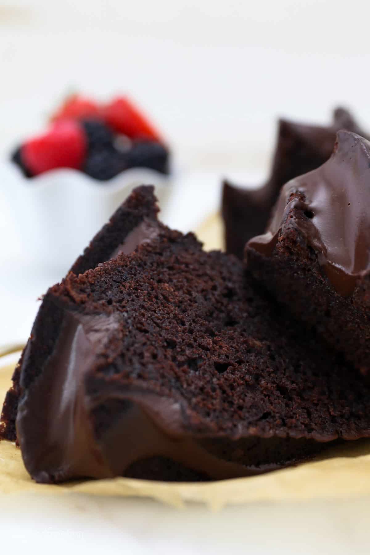Close up of chocolate bundt cake cut into slices.