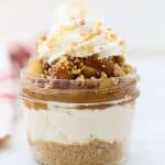 A gorgeous apple cheesecake in a jar showing all the different layers of the dessert