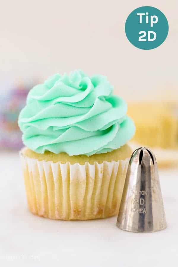 A cupcake decorating with a 2D piping tip, also known as a drop star tip