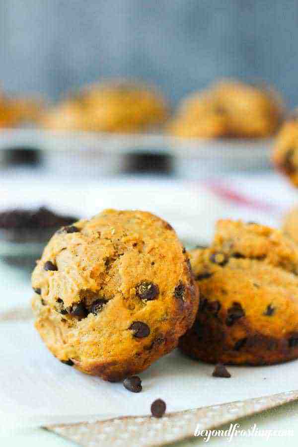 A sweet potato muffin leaning up against another muffin