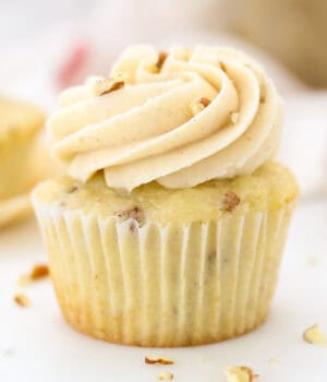 Close up of a pecan cupcake frosted with maple buttercream.