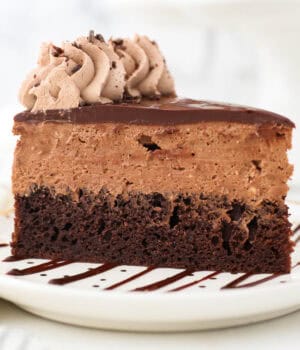 A slice of chocolate mousse cake on a white plate.