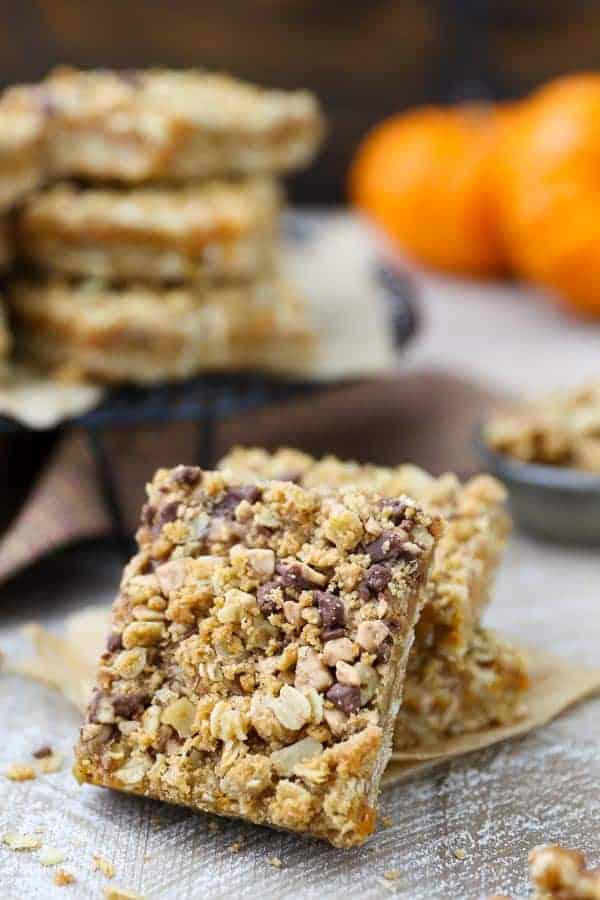 A pumpkin bar leaving up against a stack of more bars
