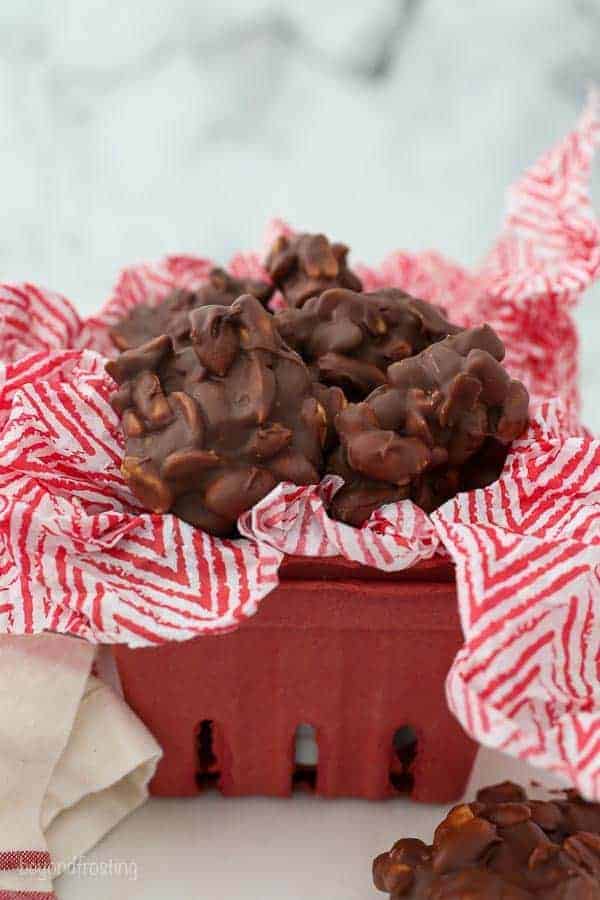 A cute red berry basket filled with festive peanut clusters