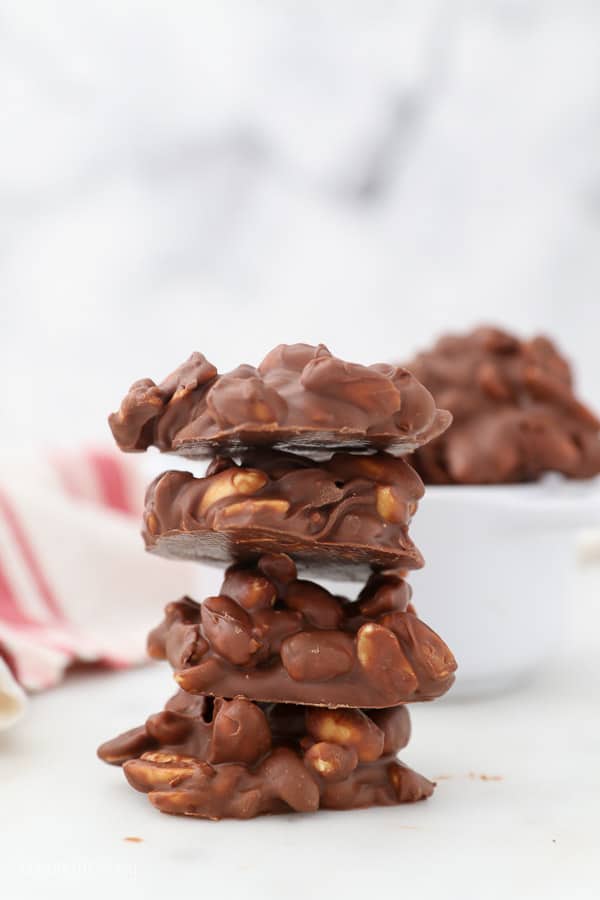 A stack of 4 chocolate covered peanut clusters