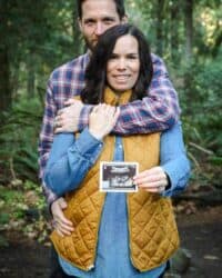 A baby announcement with the husband and wife holding an Ultrasound photo