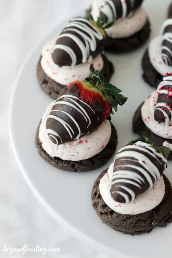 An overhead shot of chocolate cookies with stawberries on a cake mix