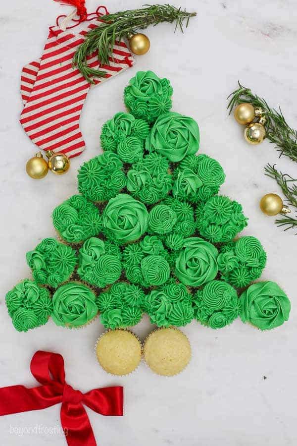 A Christmas tree made out of cupcake, a process shot showing the first couple of steps to make this cake