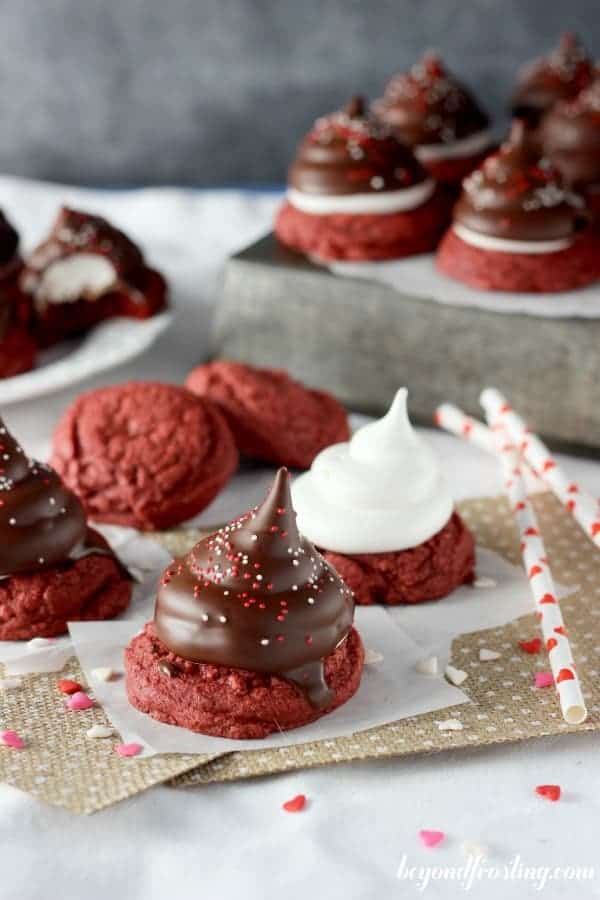 A couple piece of burlap with hi hat cookies sitting on top and heart shaped sprinkles