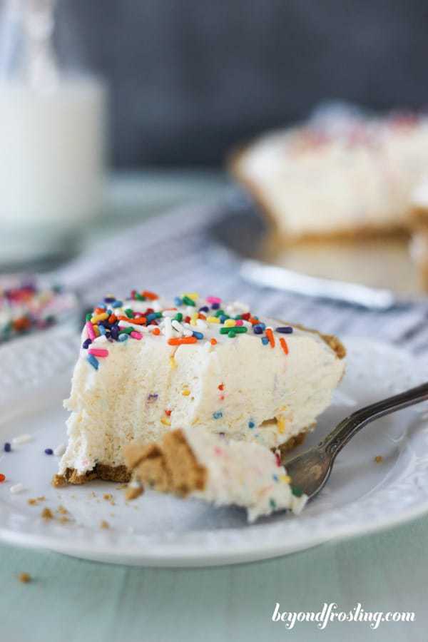 A slice of funfetti pie with a couple bites taken out of it