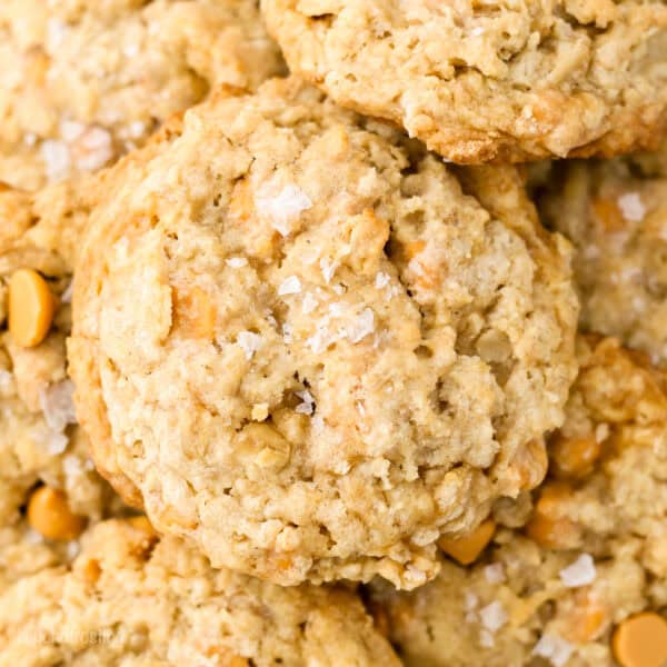 Overhead view of oatmeal butterscotch cookies piled on a plate.