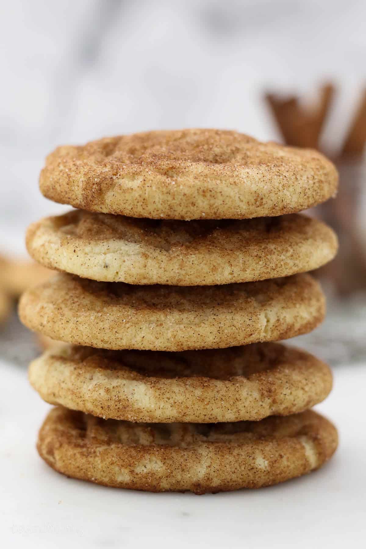 A stack of brown butter snickerdoodles on a countertop.