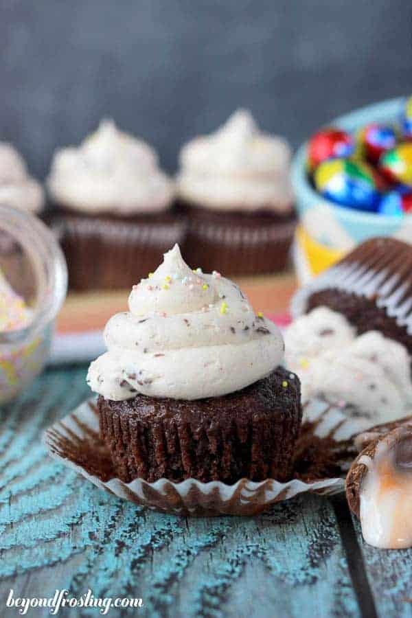 A chocolate cupcake decorated with Easter sprinkles