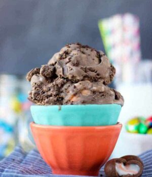 Two colorful bowl with scoop of chocolate ice cream