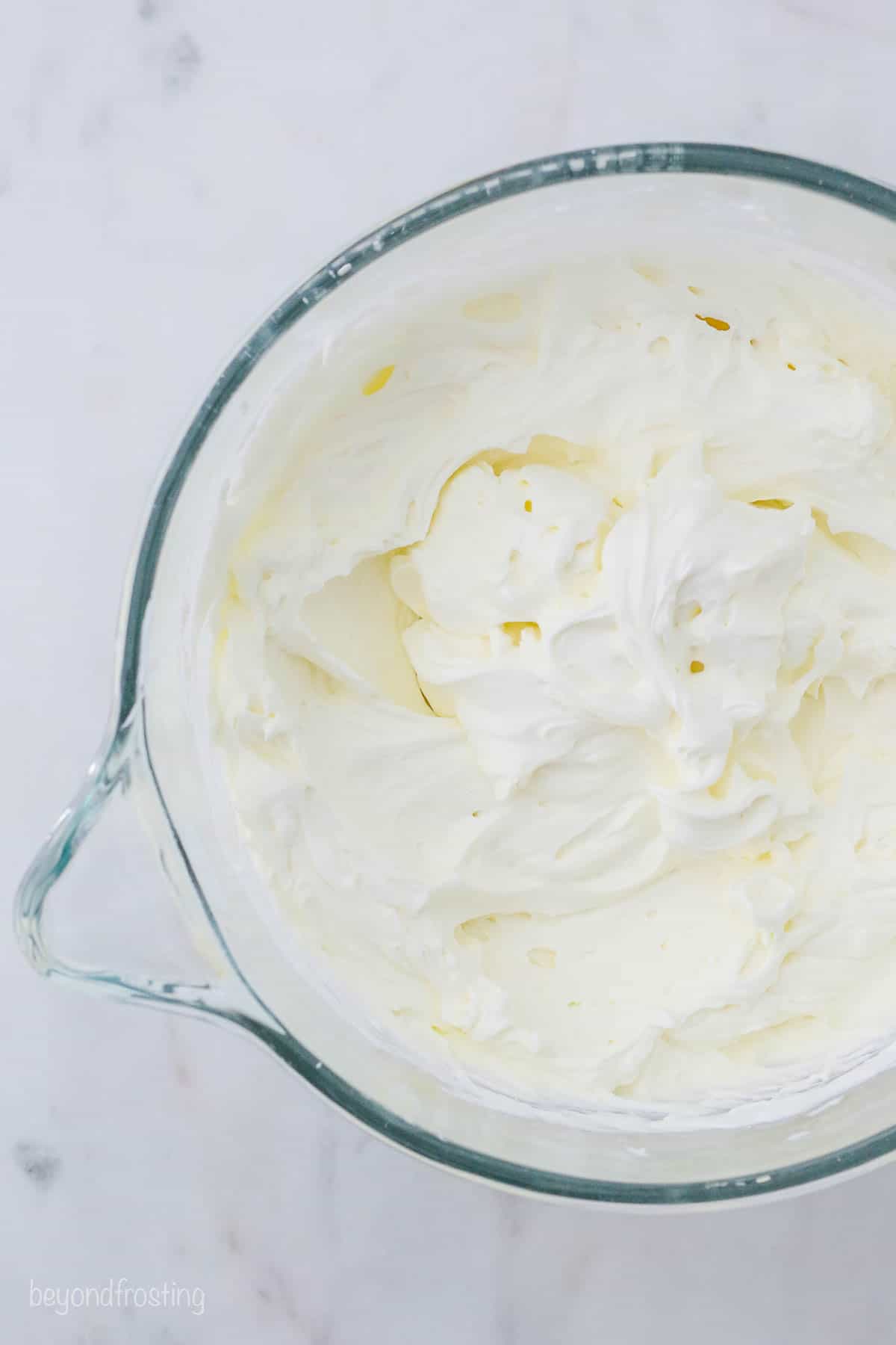 Mascarpone whipped cream in a mixing bowl