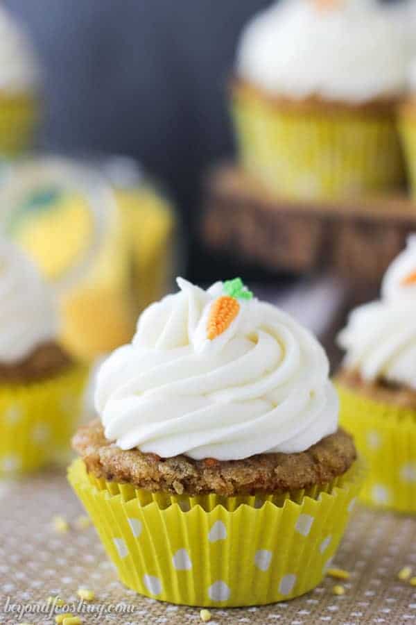 A close up photo of a Carrot Cake Cupcake with cream cheese frosting swirl