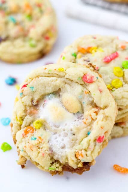 Angled view of two fruity pebble marshmallow cookies