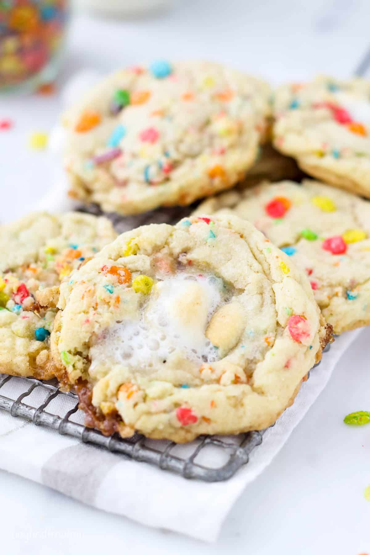 Overhead view of fruity pebble marshmallow cookies on a cooling rack