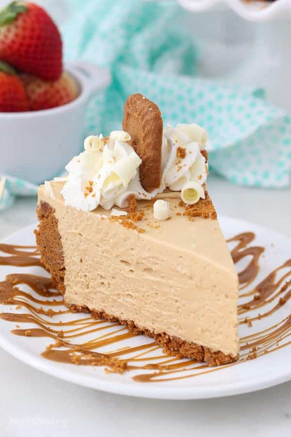 A gorgeous slice of pie with whipped cream and Biscoff cookies on top